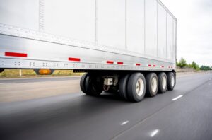 Big,rig,powerful,semi,truck,transports,a,heavy Duty,four Axle,semi