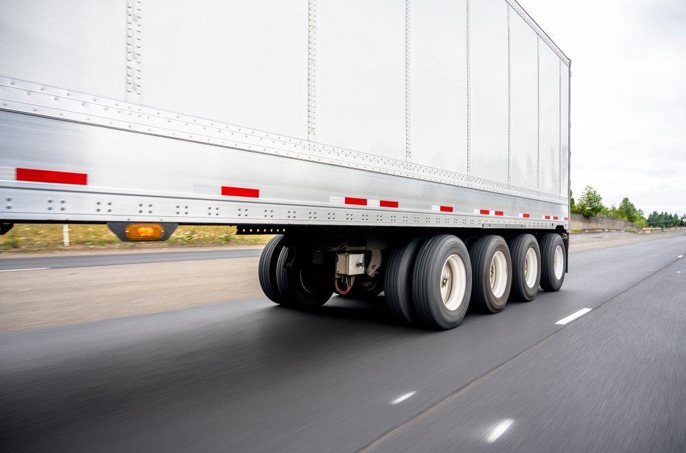 Big,rig,powerful,semi,truck,transports,a,heavy Duty,four Axle,semi