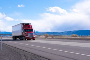 Big,rig,american,bonnet,powerful,red,semi,truck,with,refrigerated
